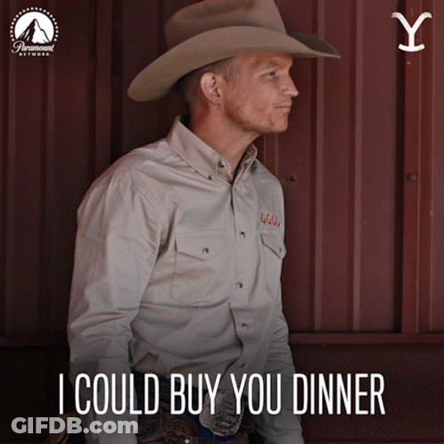 A Man Wearing A Cowboy Hat And A Shirt That Says I Could Buy You Dinner GIF