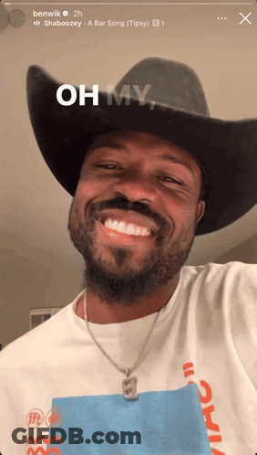 A Man Wearing A Cowboy Hat And A Shirt That Says Oh My On It GIF