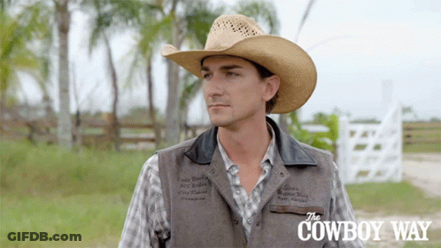 A Man Wearing A Cowboy Hat And A Vest With The Cowboy Way Written On The Bottom GIF