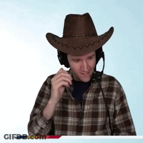 A Man Wearing A Cowboy Hat And Headphones Talks On A Phone GIF