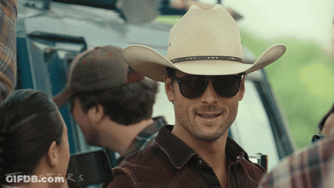 A Man Wearing A Cowboy Hat And Sunglasses Has The Word Twisters On The Bottom GIF