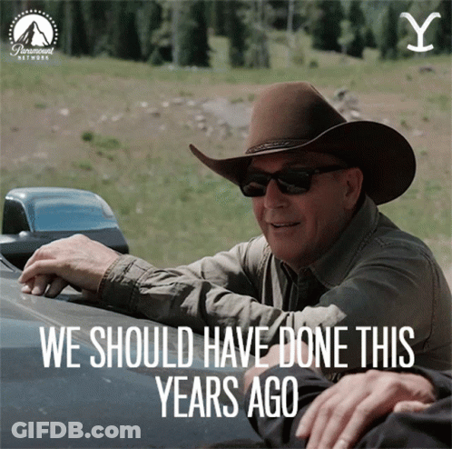 A Man Wearing A Cowboy Hat And Sunglasses Is Sitting In A Car With The Words We Should Have Done This Years Ago GIF