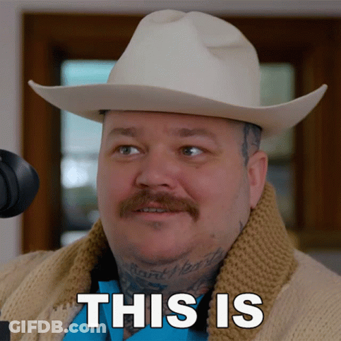 A Man Wearing A Cowboy Hat And Sweater Says " This Is " In Black Letters GIF