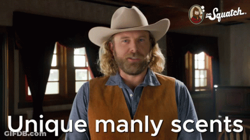 A Man Wearing A Cowboy Hat And Vest With The Words Unique Manly Scents Below Him GIF