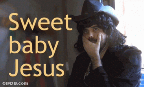 A Man Wearing A Cowboy Hat Covering His Mouth With His Hand And The Words Sweet Baby Jesus Written Above Him GIF