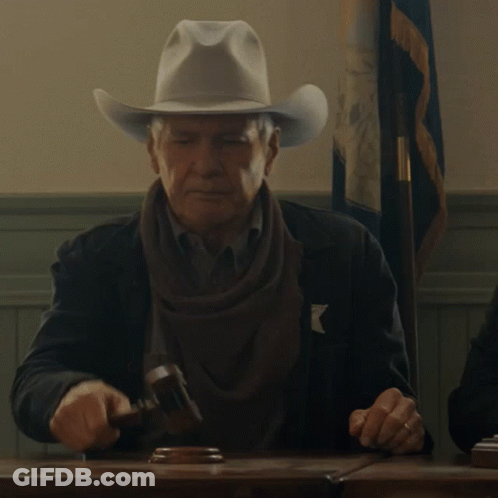 A Man Wearing A Cowboy Hat Holds A Hammer GIF