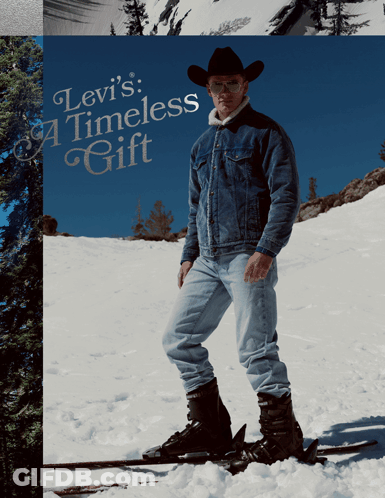 A Man Wearing A Cowboy Hat Is Standing On Skis In The Snow With The Words Levi 'S Timeless Gift Behind Him GIF