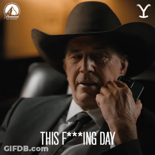 A Man Wearing A Cowboy Hat Is Talking On A Cell Phone With The Words This F *** Ing Day Below Him GIF