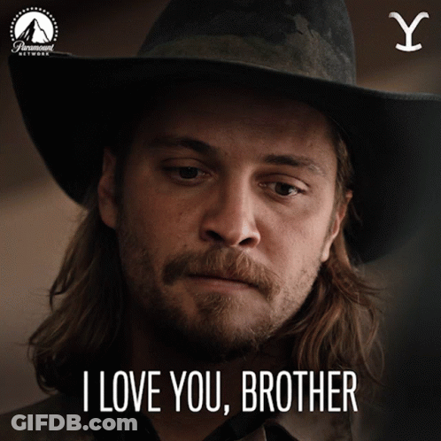 A Man Wearing A Cowboy Hat With The Words I Love You Brother Below Him GIF