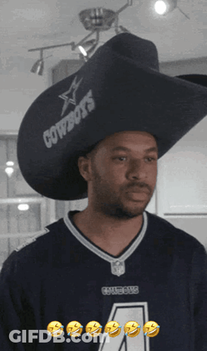 A Man Wearing A Cowboys Jersey And A Cowboy Hat GIF