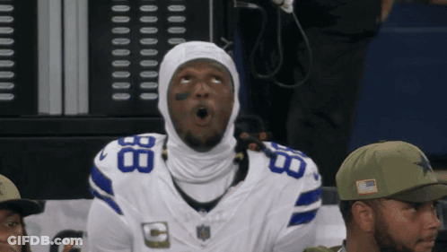 A Man Wearing A Cowboys Jersey With The Number 8 On The Front GIF