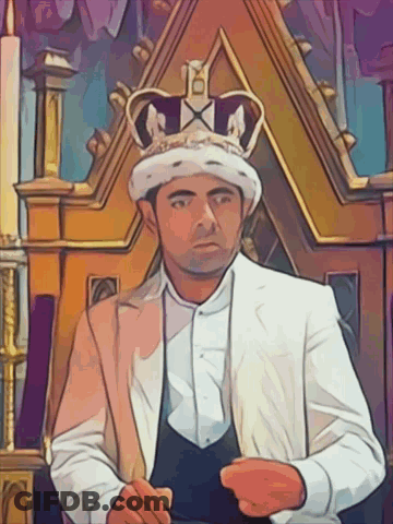 A Man Wearing A Crown Is Sitting On A Throne With The Letter A On It GIF