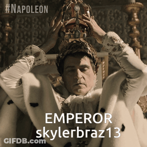 A Man Wearing A Crown With The Word Emperor On It GIF