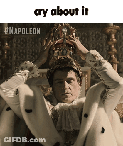 A Man Wearing A Crown With The Words Cry About It Written Below Him GIF