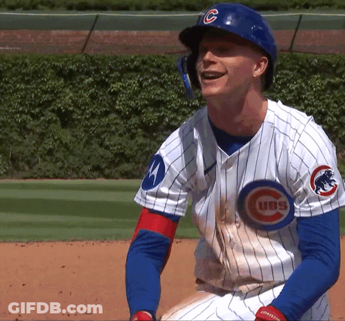 A Man Wearing A Cubs Jersey Is Smiling On The Field GIF