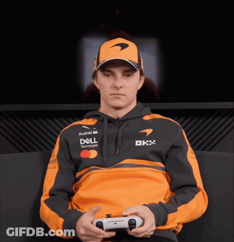 A Man Wearing A Dell Hoodie Is Holding A Playstation Controller GIF