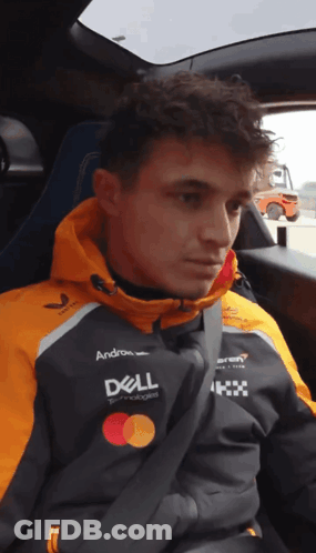 A Man Wearing A Dell Jacket Sits In A Car Seat GIF