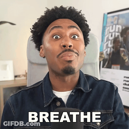 A Man Wearing A Denim Jacket Says Breathe GIF