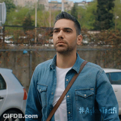 A Man Wearing A Denim Shirt That Says #Ask Tarifi GIF