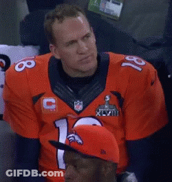 A Man Wearing A Denver Broncos Jersey With The Number 18 On It GIF