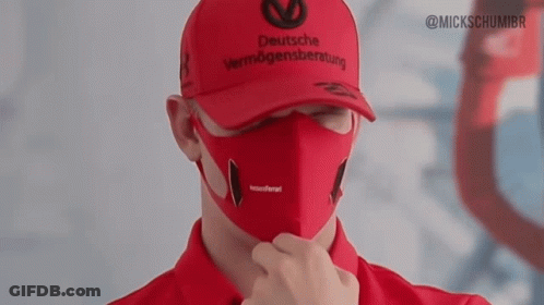 A Man Wearing A Deutsche Vermögensberatung Hat And A Face Mask GIF