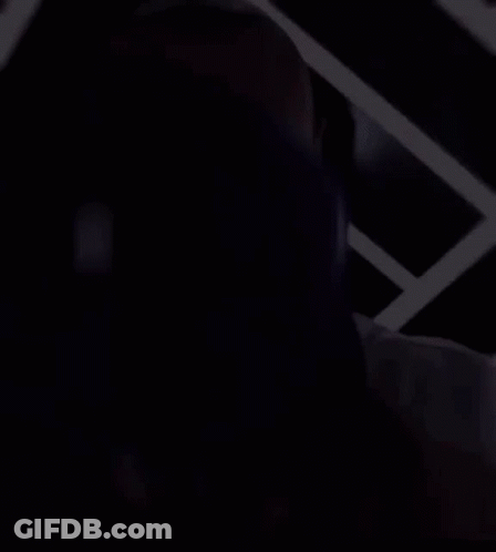A Man Wearing A Dodgers Jersey Is Covering His Face GIF