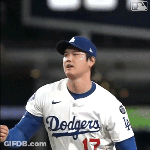 A Man Wearing A Dodgers Jersey With The Number 17 GIF