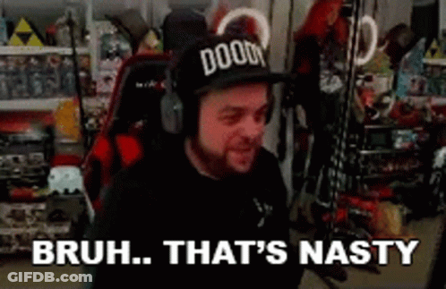 A Man Wearing A Doom Hat And Headphones Is Sitting In A Chair In A Room . GIF