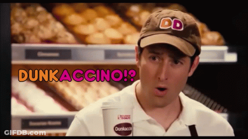 A Man Wearing A Dunkin Donuts Hat Is Holding A Cup GIF