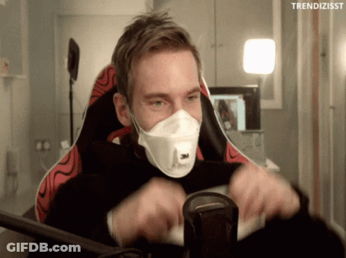 A Man Wearing A Face Mask Is Sitting In A Chair With The Words Trendizisst Above Him GIF