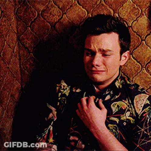 A Man Wearing A Floral Shirt Is Crying GIF