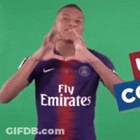 A Man Wearing A Fly Emirates Jersey Makes A Heart Shape With His Hands GIF