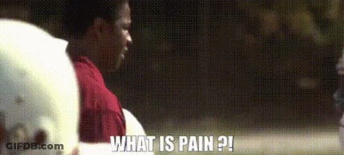 A Man Wearing A Football Helmet Is Asking What Is Pain GIF