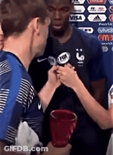 A Man Wearing A Fox Logo On His Shirt GIF