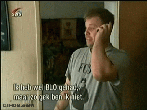 A Man Wearing A Fox Shirt Is Talking On The Phone GIF