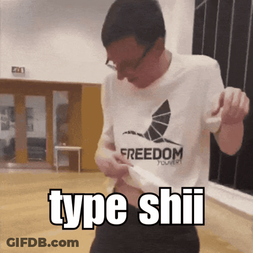 A Man Wearing A Freedom T-Shirt Is Dancing In A Room GIF