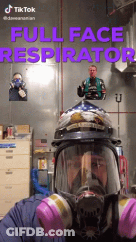 A Man Wearing A Full Face Respirator With A Helmet On GIF
