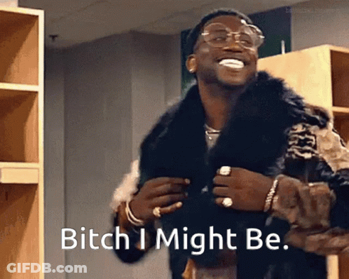 A Man Wearing A Fur Coat And Glasses Says " Bitch I Might Be " GIF