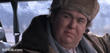 A Man Wearing A Fur Hat And A Jacket Is Sitting In A Car . GIF