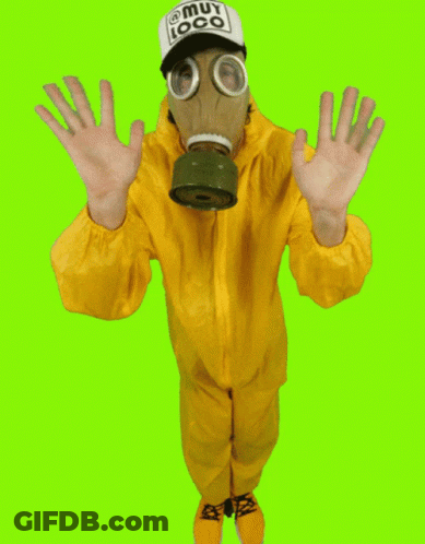 A Man Wearing A Gas Mask And A Hat That Says Muy Loco On It GIF