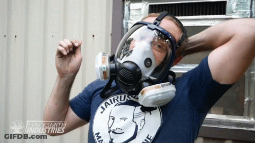 A Man Wearing A Gas Mask And A Shirt That Says Jairus GIF
