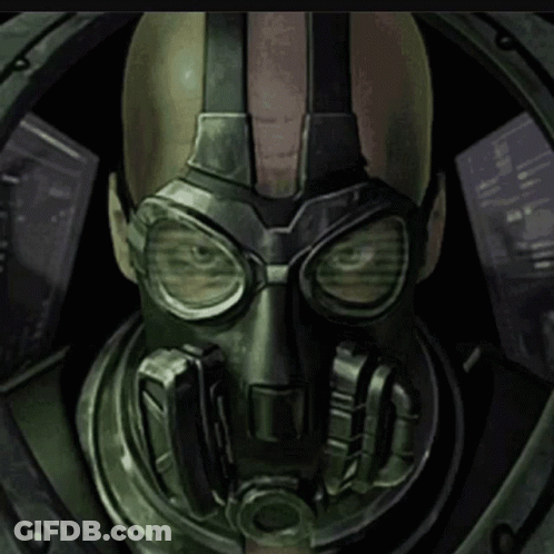 A Man Wearing A Gas Mask And Goggles Looks Out A Window GIF