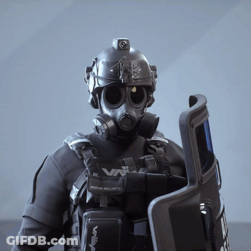A Man Wearing A Gas Mask Is Holding A Shield That Says Arena Security On It GIF