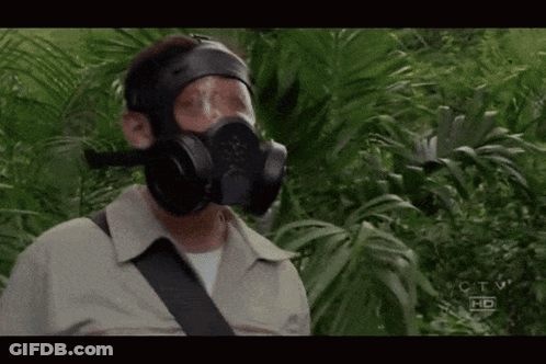 A Man Wearing A Gas Mask Is Standing In A Jungle With The Letters Ctv Hd On The Bottom Right GIF