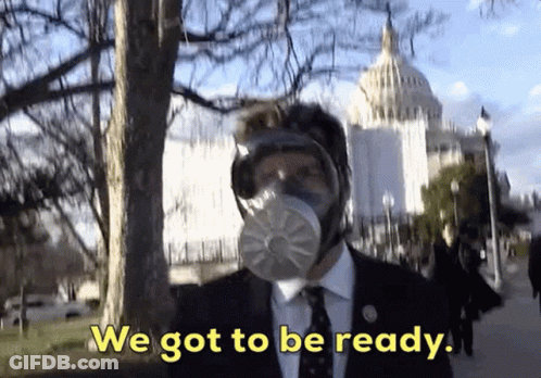 A Man Wearing A Gas Mask Says We Got To Be Ready In Front Of The Capitol Building GIF