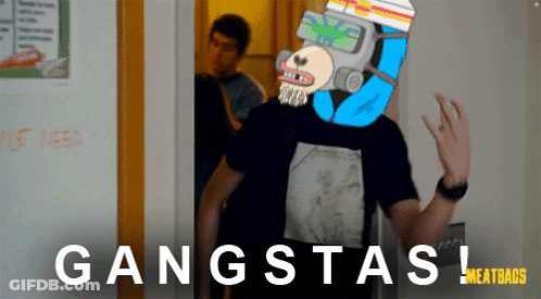 A Man Wearing A Gas Mask Stands In Front Of A Door With The Words Gangsta Written On It GIF