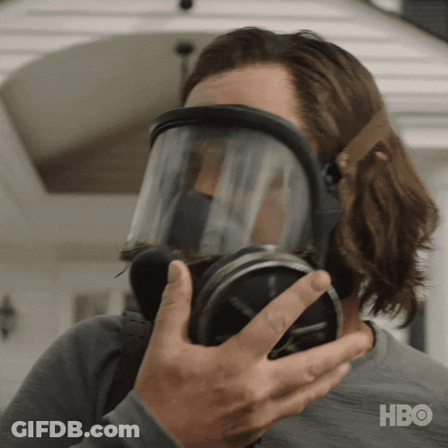 A Man Wearing A Gas Mask With Hbo Written On The Bottom Right GIF