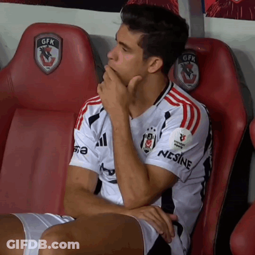 A Man Wearing A Gfk Jersey Sits In A Locker Room GIF