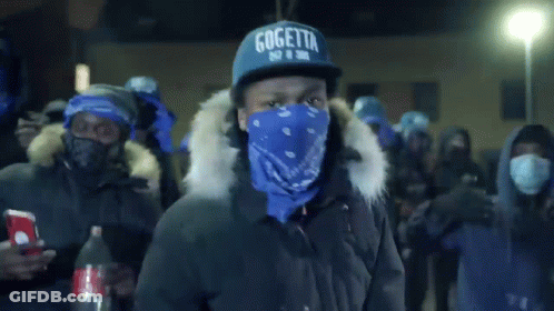 A Man Wearing A Gogetta Hat And A Blue Bandana GIF