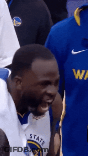 A Man Wearing A Golden State Warriors Jersey Is Yelling GIF